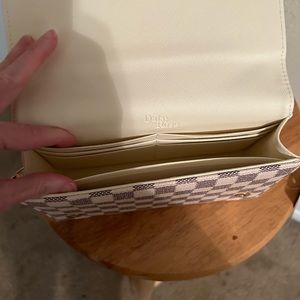 Daily Rose cream cross body wallet clutch. New never used